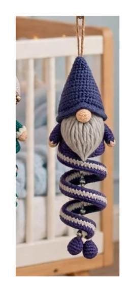 Finished Gnome spiral ornament — tall purple hat, cream beard with skin beige nose, and purple spiral body