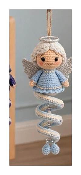 Finished Angel spiral ornament — pale blue spiral dress, white curls, gold halo, silver-grey wings, and gentle embroidered face