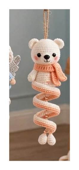 Finished Polar Bear spiral ornament — white head with round ears and muzzle, peach scarf, and cream spiral with peach trim